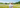 woman with bucket hat in a sunny meadow