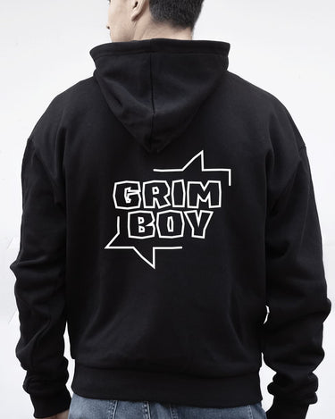 Person wearing a black hoodie with 'GRIM BOY' text on the back against a white background