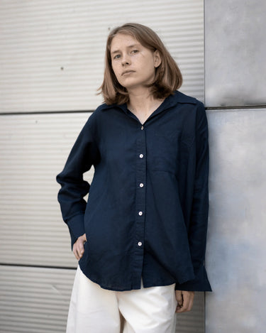 women's navy linen shirt worn by a model