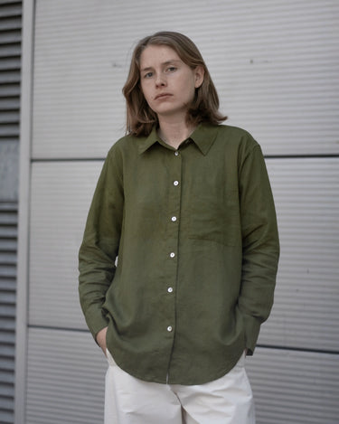 women's olive green linen shirt worn by a model