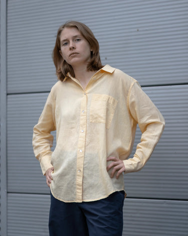 women's yellow linen shirt worn by a model