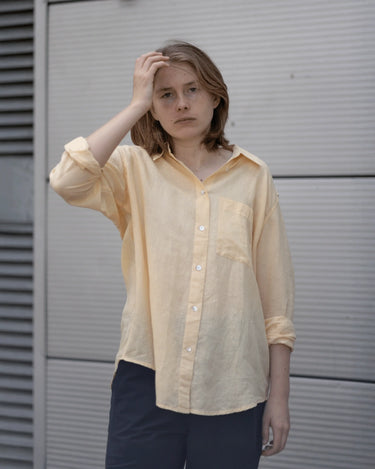 women's yellow linen shirt worn by a model