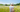 woman with bucket hat in a sunny meadow