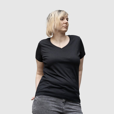 Model (5'8") wearing size L black V-neck organic cotton t-shirt.