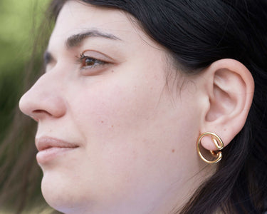 model wearing twin loop hoop earrings