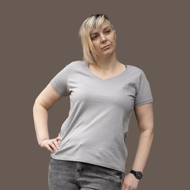 Model (5'8") wearing size L grey V-neck organic cotton t-shirt.