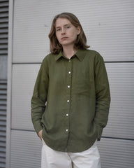 women's olive green linen shirt worn by a model