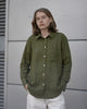 women's olive green linen shirt worn by a model
