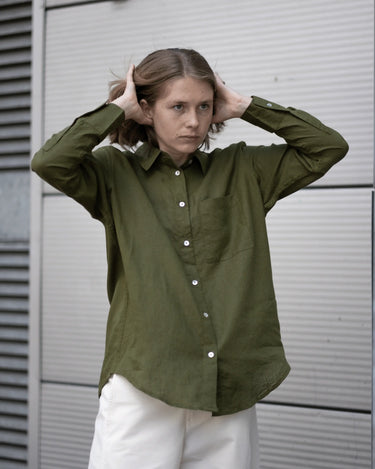 women's olive green linen shirt worn by a model