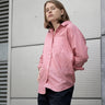 women's coral linen shirt worn by a model