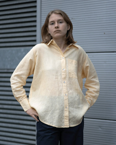women's yellow linen shirt worn by a model