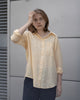 women's yellow linen shirt worn by a model